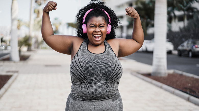 Woman excited about fitness progress