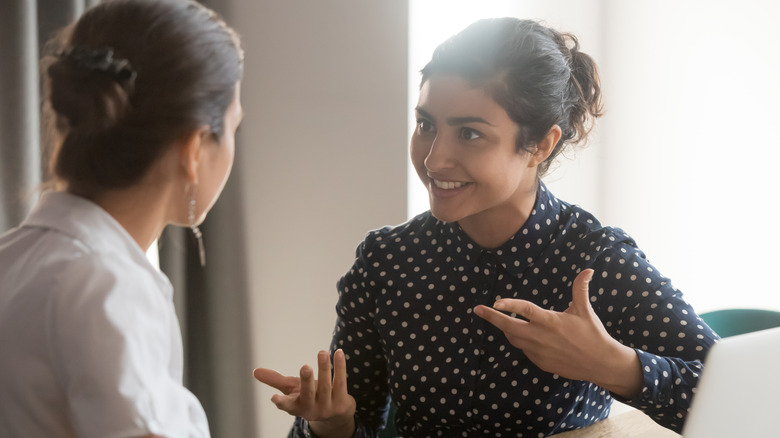 two women in conversation