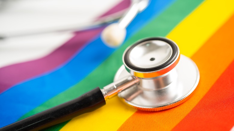 Closeup view of a stethoscope against a rainbow background