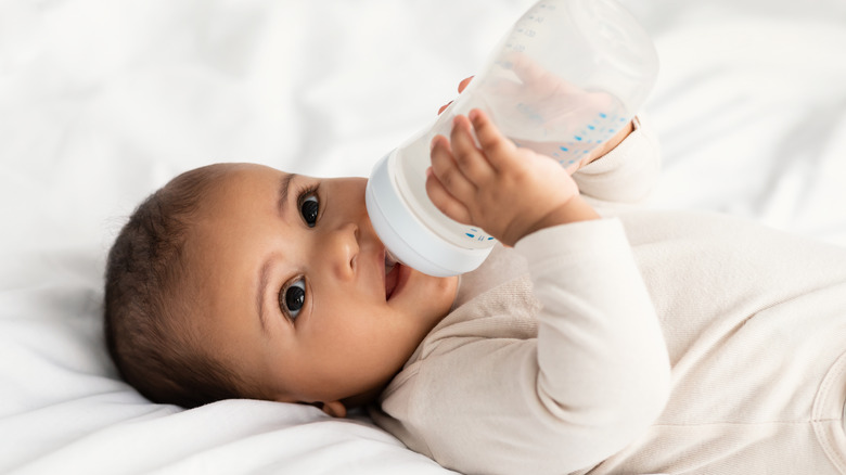 baby drinking from bottle