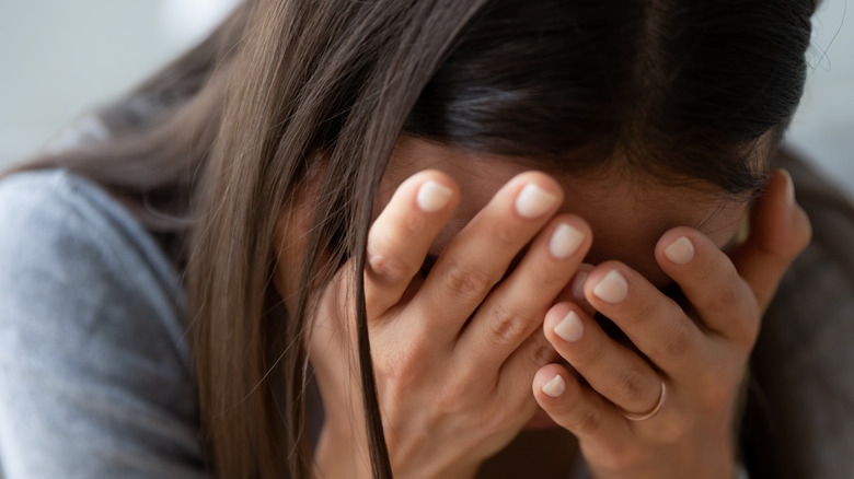woman experiencing headache