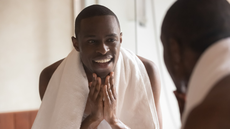 A man washes his face