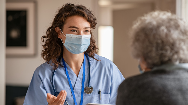 A doctor speaks with a patient