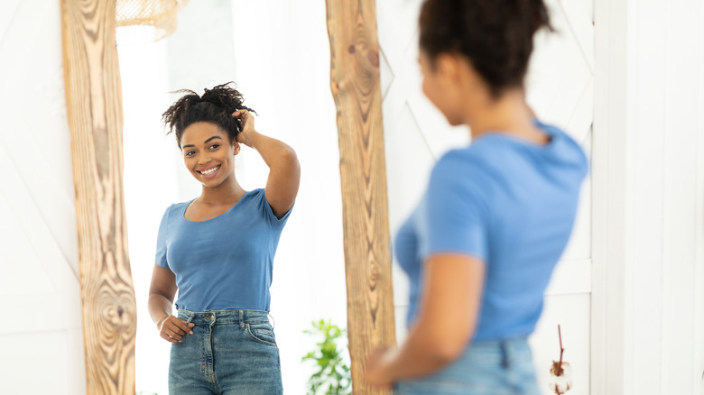 A woman is happy about her weight loss