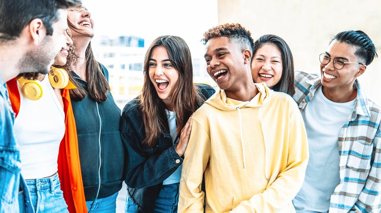Group of smiling happy teens