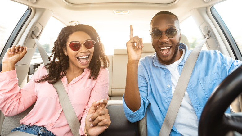Happy couple on a road trip