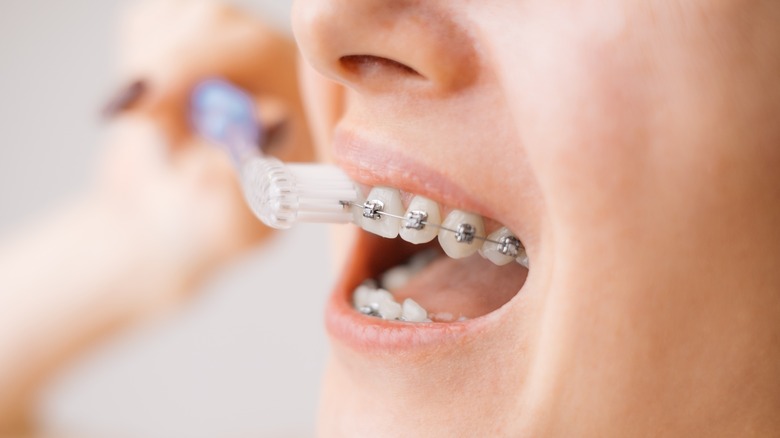 Person brushing teeth