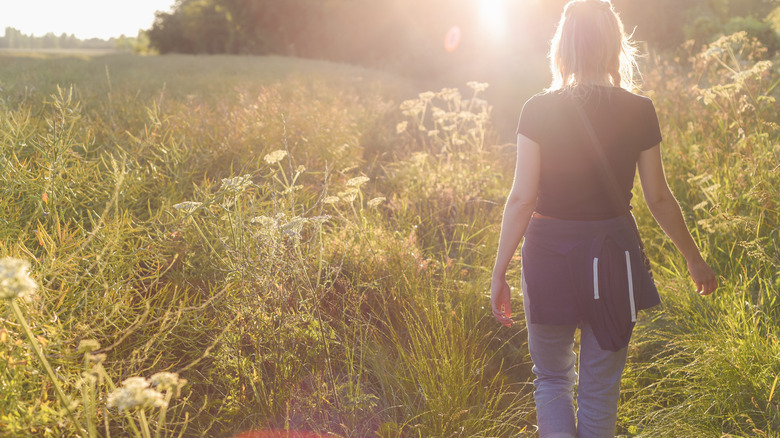 Woman walking in a field