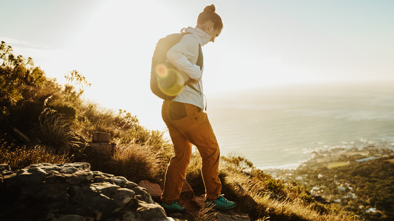 woman walking downhill