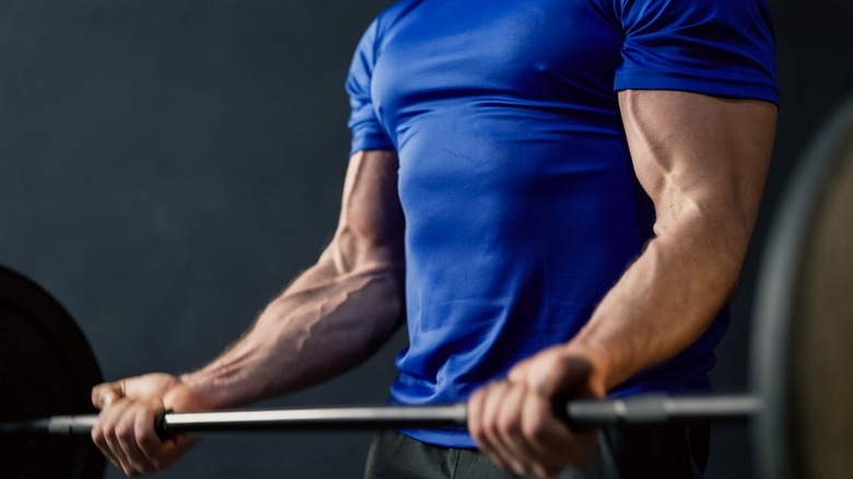 man working out with barbell