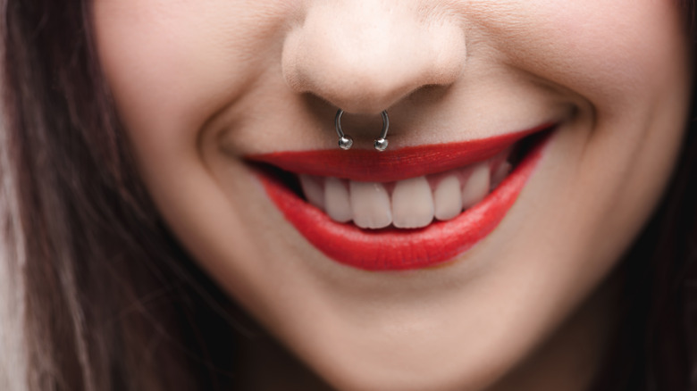 closeup of woman's nose piercing