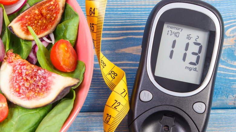 glucometer with a bowl of vegetables