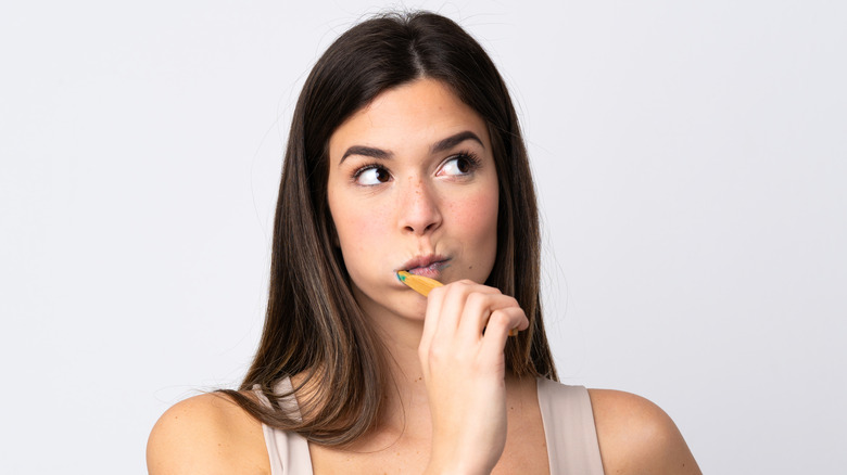 Woman brushing her teeth