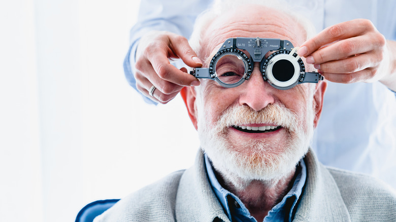 senior having eye check up