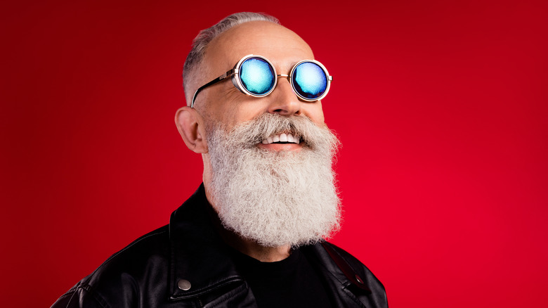 senior protecting eyes with sunglasses
