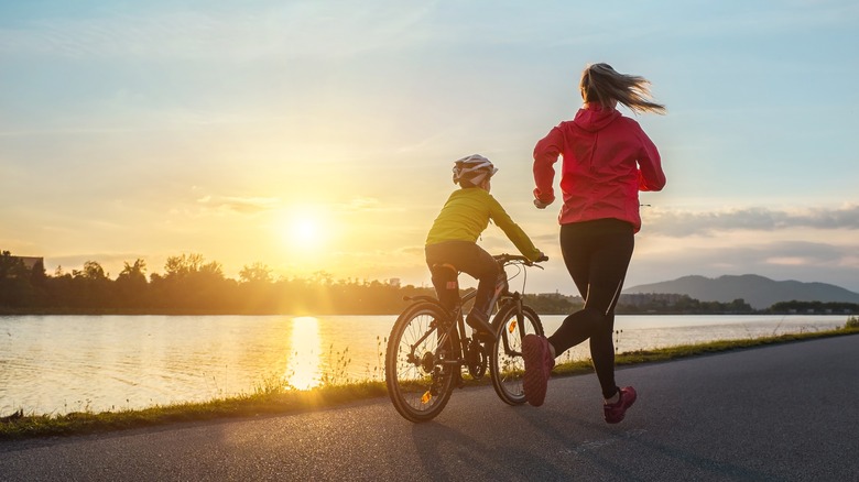 Adult and child exercising outside
