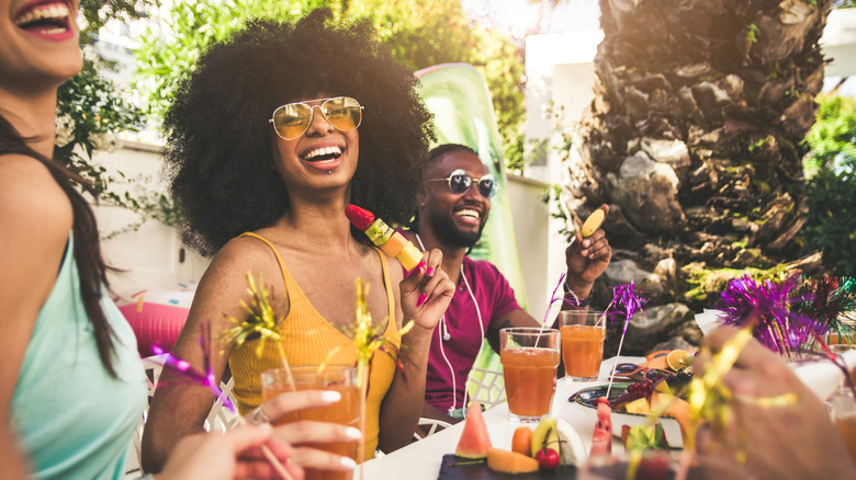 friends laughing at an outdoor party