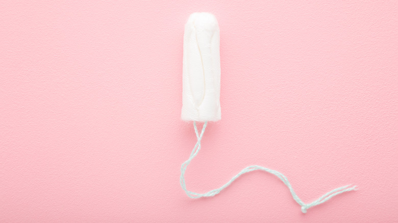 Tampon on pink background