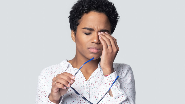 Woman with something in eye