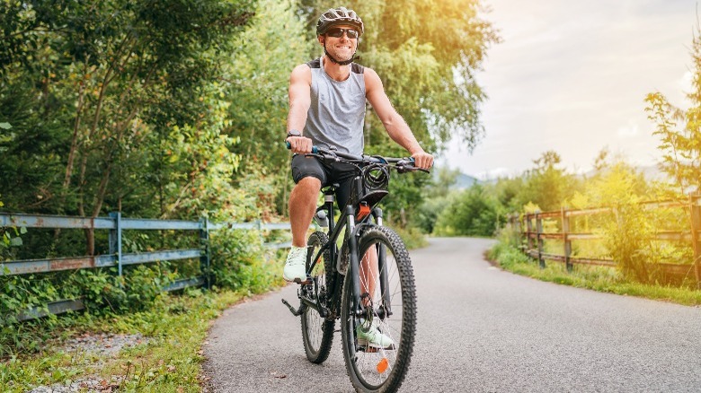 man riding bicycle outdoors