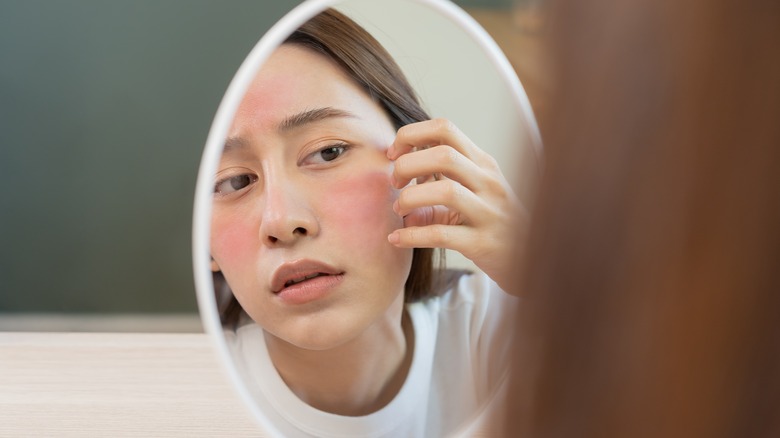woman looking in the mirror