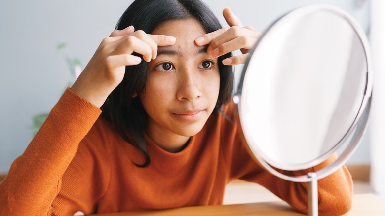 girl looking in the mirror