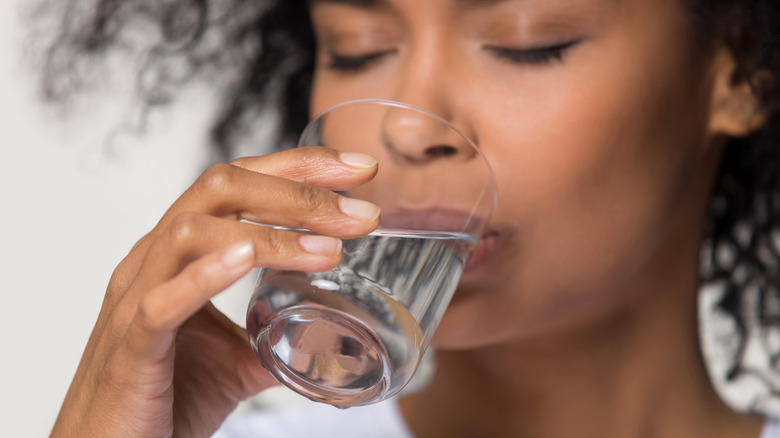 Black woman drinking water