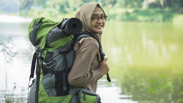 a young woman solo hiking