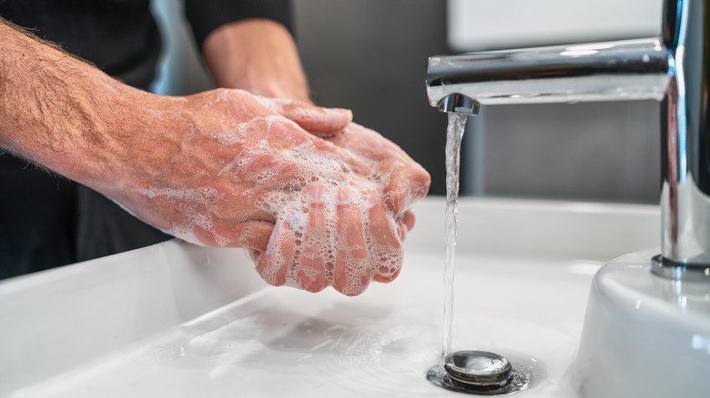 person washing hands