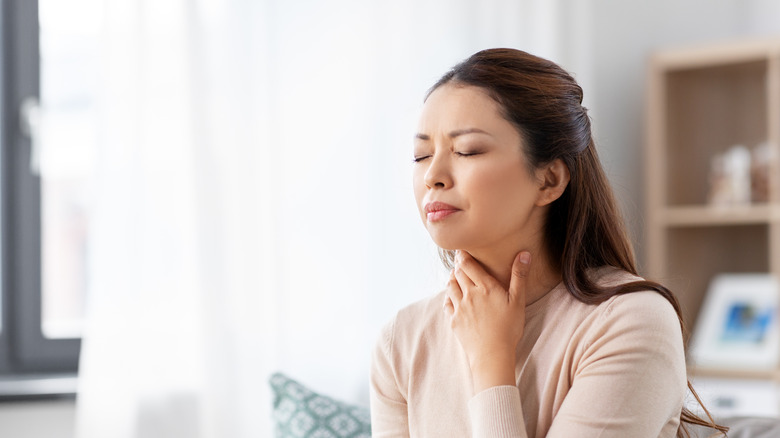 woman with sore throat