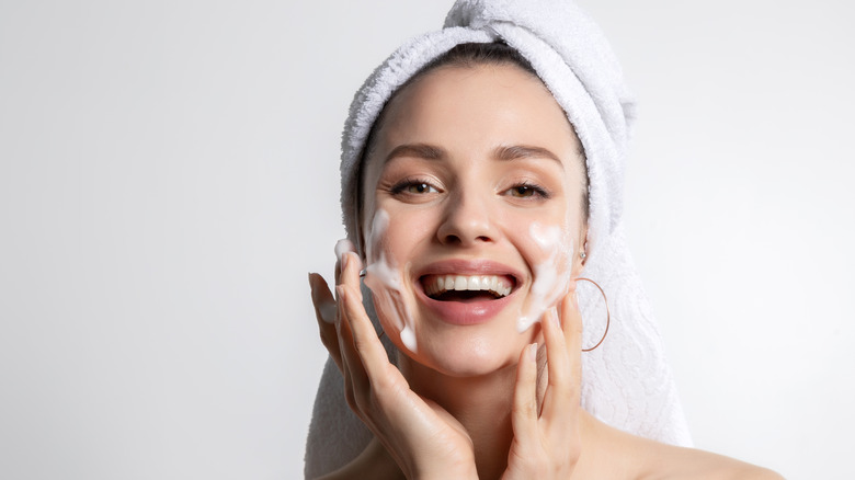 Woman washing her face