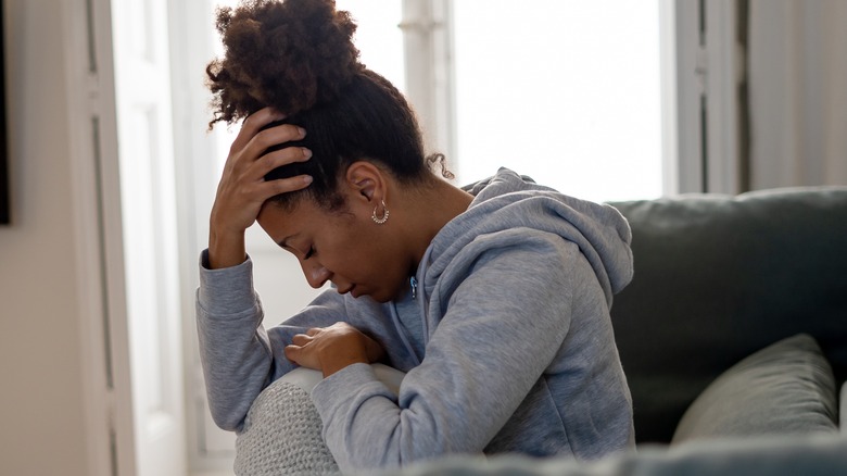 Woman depressed at home