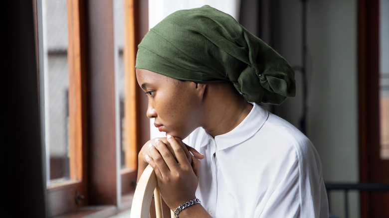 A woman with a hair wrap