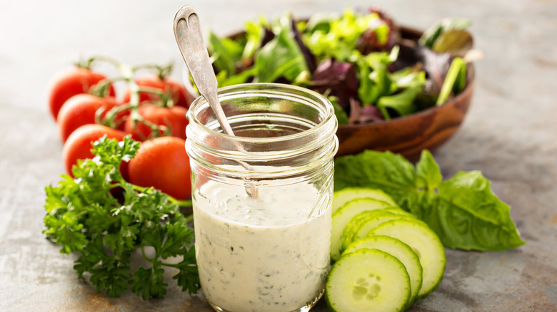 Ranch dressing in a mason jar with fresh vegetables