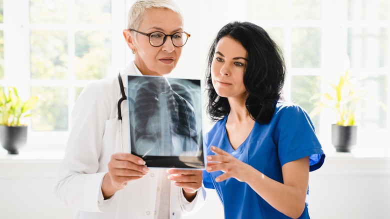 woman and doctor looking at lung scan