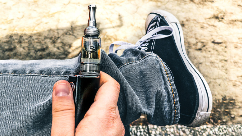 Hand holding electronic cigarette