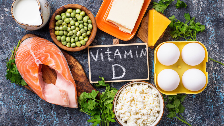 A range of foods containing vitamin D against a slate backdrop