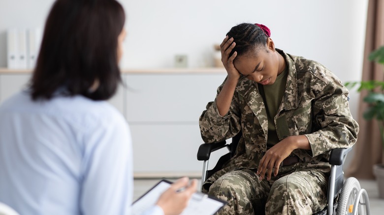 Disabled Black veteran meeting with doctor