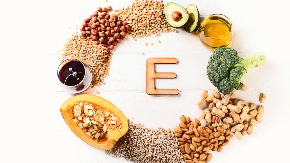 different foods containing vitamin e on a table