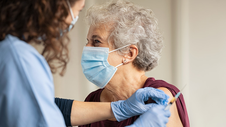 woman getting covid vaccine