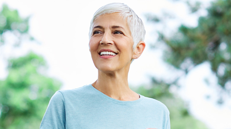 smiling older woman exercising