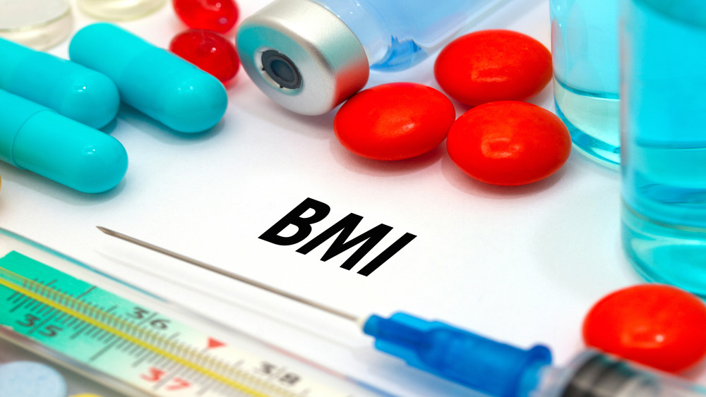 Letters "BMI" with syringe 