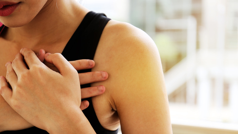 woman holding her heart