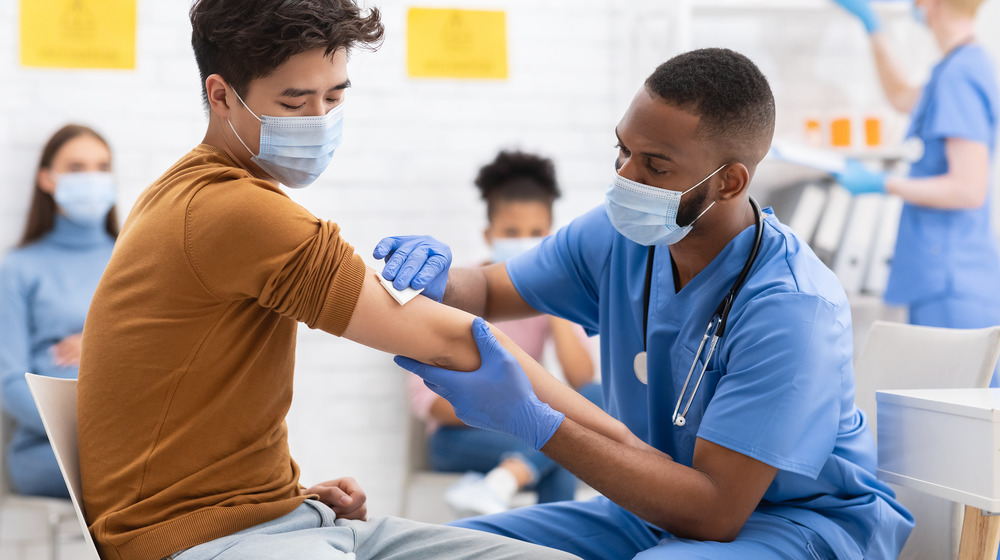 Nurse giving COVID-19 Vaccine