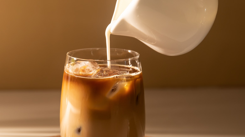 Milk poured into coffee