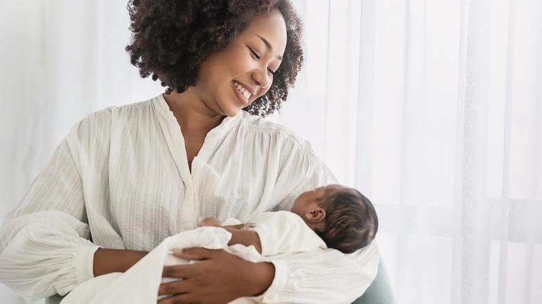 woman holding her baby