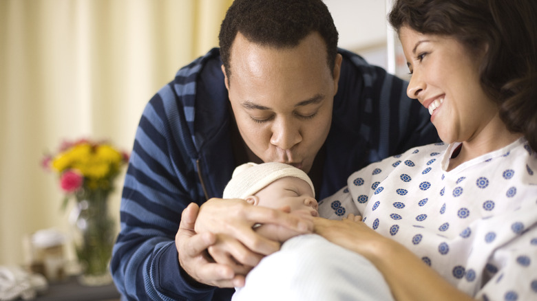 parents with their newborn baby