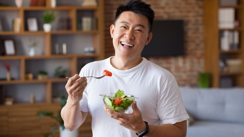 man eating healthy salad