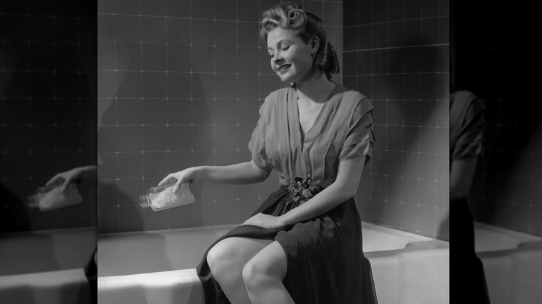 woman getting ready to have a bath in a 1950s image