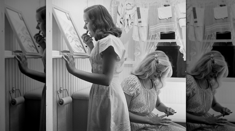 sisters in a room getting ready in the 1950s